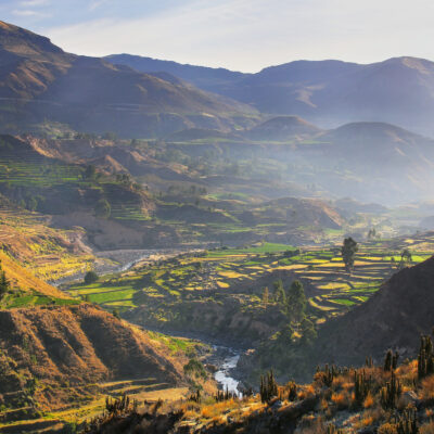 View of Colca Canyon with morning fog in Peru. It is one of the deepest canyons in the world with a depth of 3,270 meters.