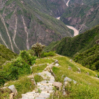 South America - Choquequirao lost ruins (mini - Machu Picchu), remote, spectacular the Inca ruins near Cuzco. Cultivated terrace fields on the steep sides of a mountain