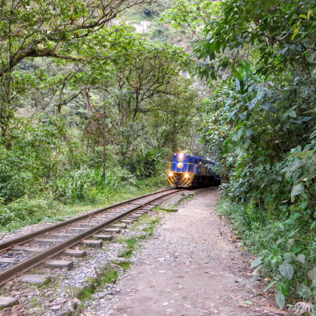 Hiking along the train tracks of Peru Rail on the road to Aguas Calientes and Machu Picchu