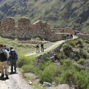 Cusco, Peru - November 14, 2010: Several hikers on the classic Inca Trail in Peru head toward the Incan ruins of Willkarakay.