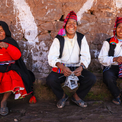 Taquile is an island on the Peruvian side of Lake Titicaca 45 km offshore from the city of Puno. About 1,700 people live on the island, which is 5.5 by 1.6 km in size (maximum measurements), with an area of 5.72 km2. The highest point of the island is 4050 meters above sea level and the main village is at 3950 m. The inhabitants, known as Taquilenos, are southern Quechua speakers. Taquilenos run their society based on community collectivism  and on the Inca moral code ama sua, ama llulla, ama qhilla, (Quechua for "do not steal, do not lie, do not be lazy"). The island is divided into six sectors or suyus  for crop rotation purposes. The economy is based on fishing, terraced farming horticulture  based on potato  cultivation, and tourist-generated income from the approximately 40,000 tourists  who visit each year.Taquilenos are known for their fine handwoven textiles and clothing, which are regarded as among the highest-quality handicrafts in Peru. Everyone on the island - children, women, and men - spins and weaves.http://bem.2be.pl/IS/peru_380.jpg