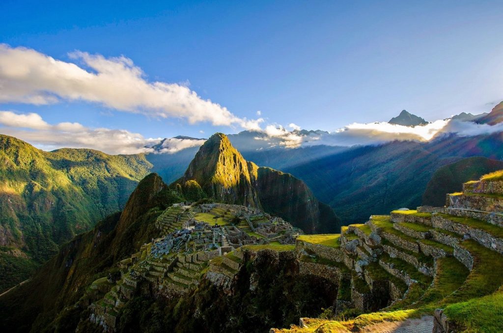 Machu Picchu green and wrapped in cloud during the Andean wet season