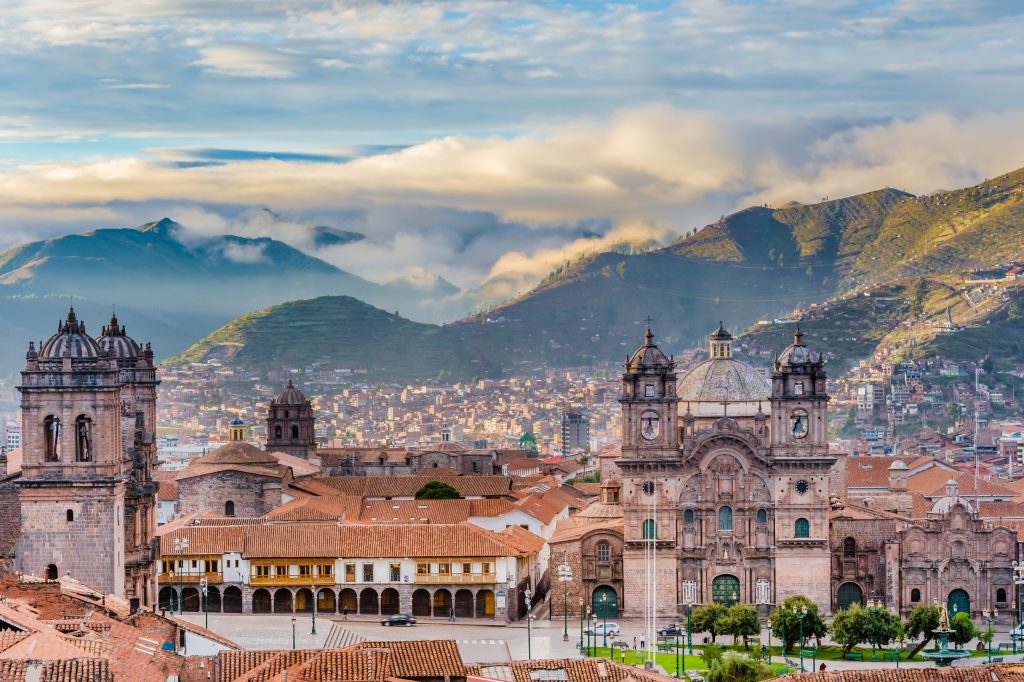 Morning sun over the rooftops and cathedral of Cusco during the Andean dry season