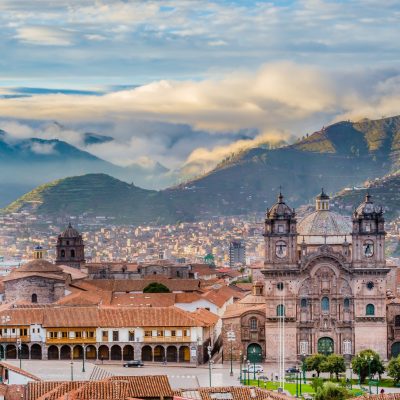 Morning sun over the rooftops and cathedral of Cusco during the Andean dry season