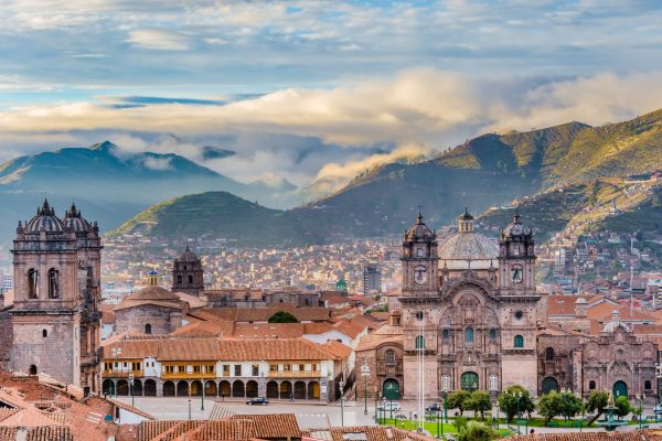 Morning sun over the rooftops and cathedral of Cusco during the Andean dry season