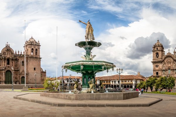 Panoramic view of Plaza de Armas with Inca fountain, Cathedral and Compania de Jesus Church - Cusco, Peru